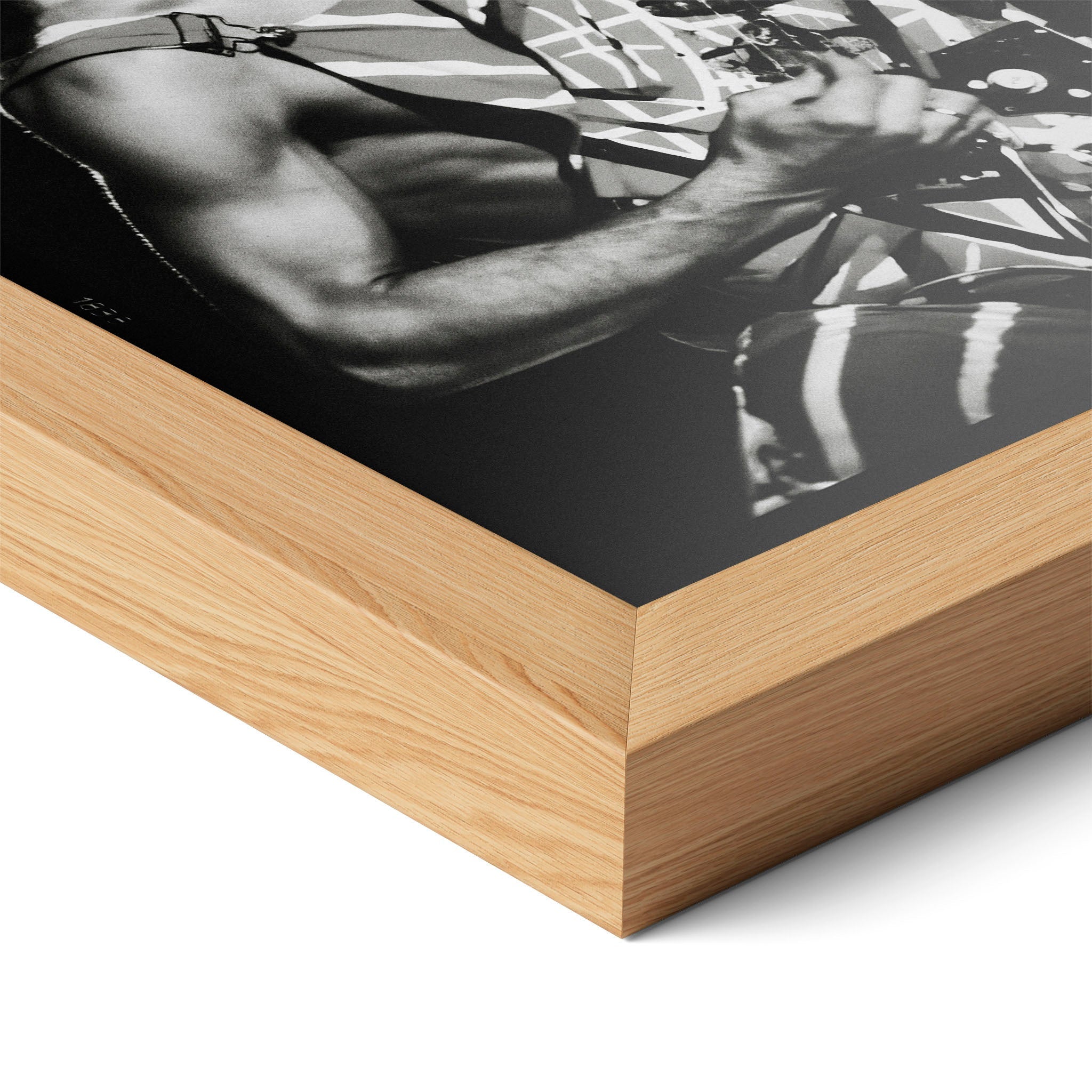 Corner close-up highlighting the natural oak finish of the framed Eddie Van Halen black and white poster.