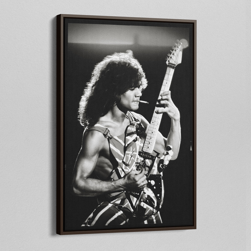 Angled view of the Eddie Van Halen black and white canvas in a sophisticated dark walnut floating frame.