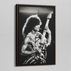 Angled view of the Eddie Van Halen black and white canvas in a sophisticated dark walnut floating frame.