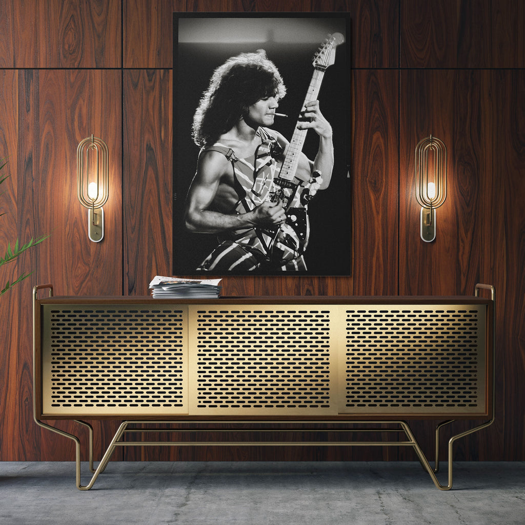 Sleek aluminum black and white metal print of Eddie Van Halen displayed over a mid-century modern credenza.