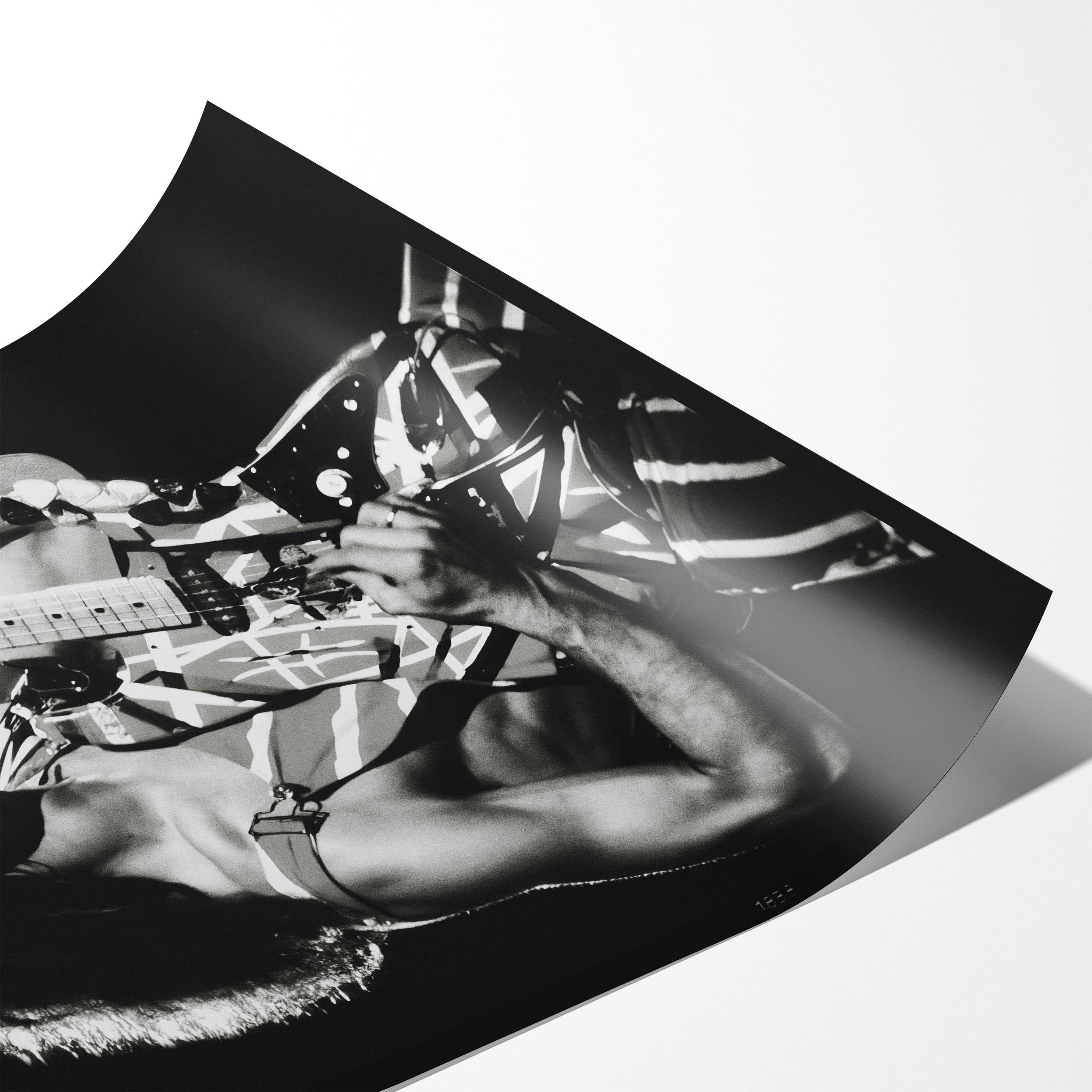 Angled close-up of the unframed premium matte black and white Eddie Van Halen 1982 concert poster print.