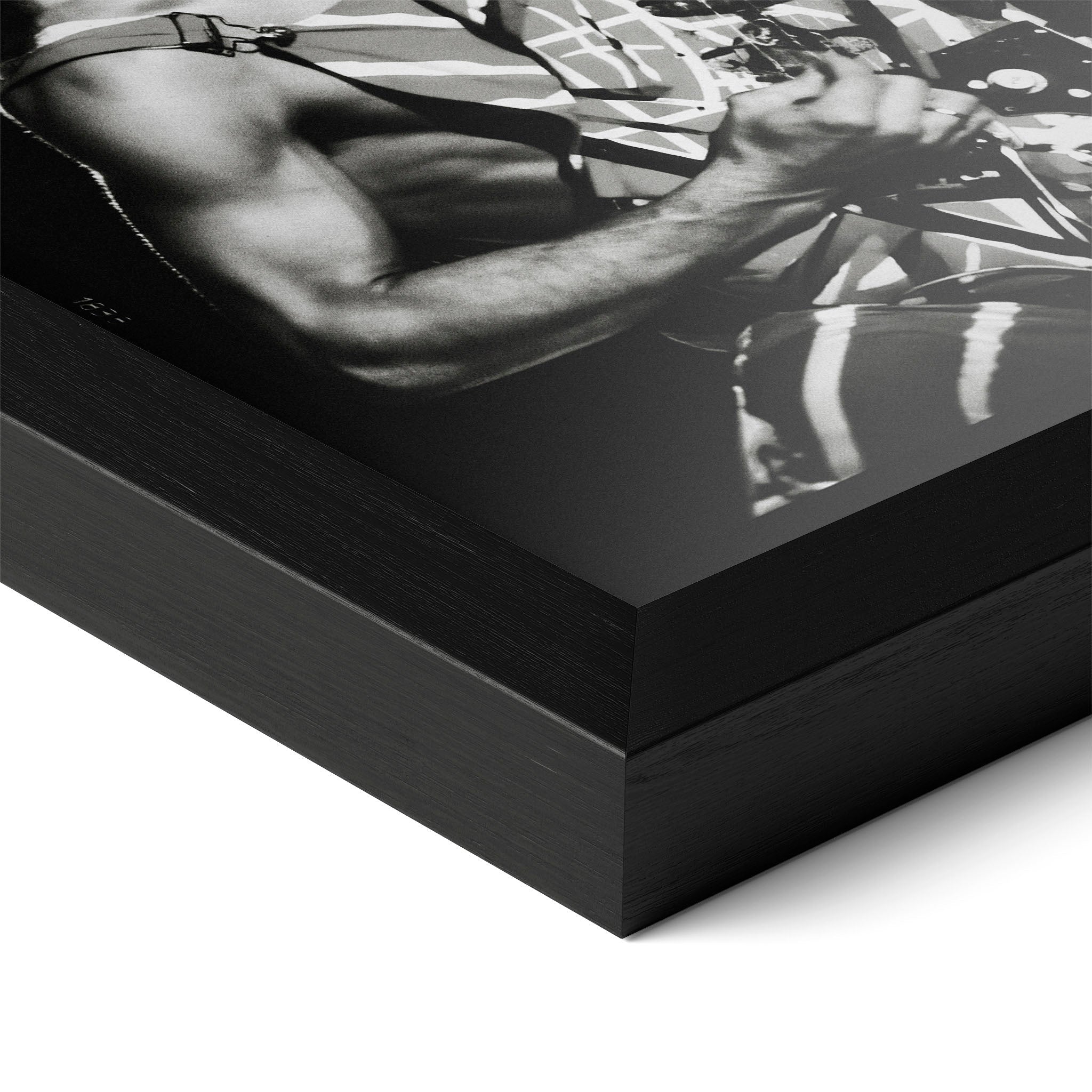 Detailed corner close-up of the premium black wooden frame holding the Eddie Van Halen black and white rock poster.