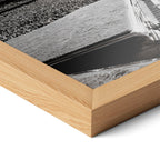 Corner close-up highlighting the natural oak finish of the framed Elton John 1975 black and white poster.