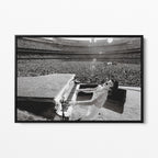 Front view of the Elton John 1975 black and white canvas in a sleek black floating frame.