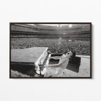 Front display of the Elton John 1975 black and white canvas in a premium dark walnut floating frame.