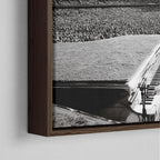 Corner close-up showing the rich grain and joinery of the dark walnut floating canvas frame.