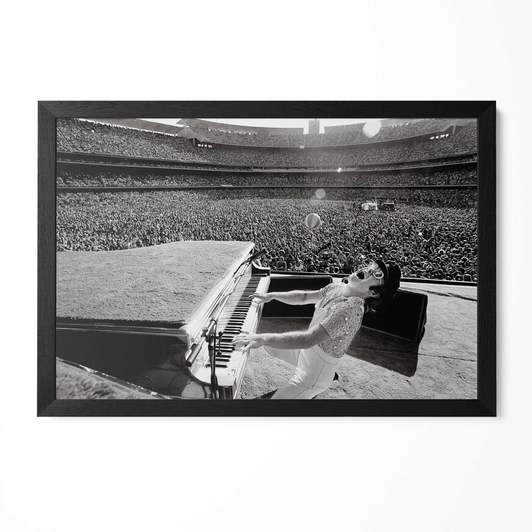 Elton John 1975 Dodger Stadium black and white concert poster in a premium classic black wooden frame by POSTEREVER.