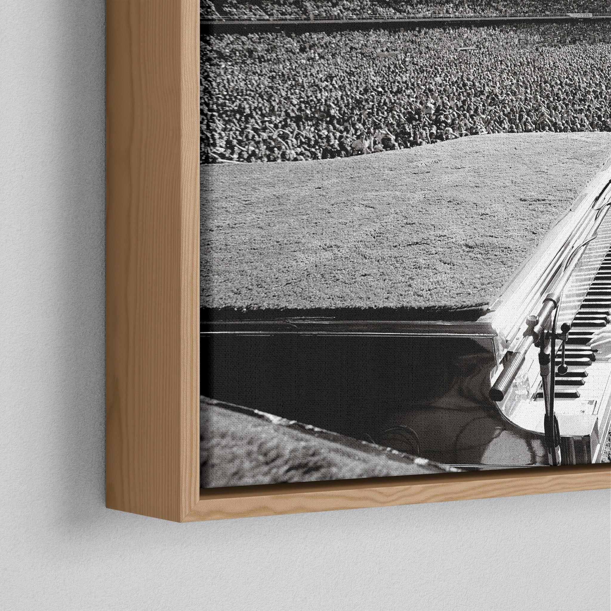 Corner close-up of the floating gap and grain texture of the natural wood canvas frame.