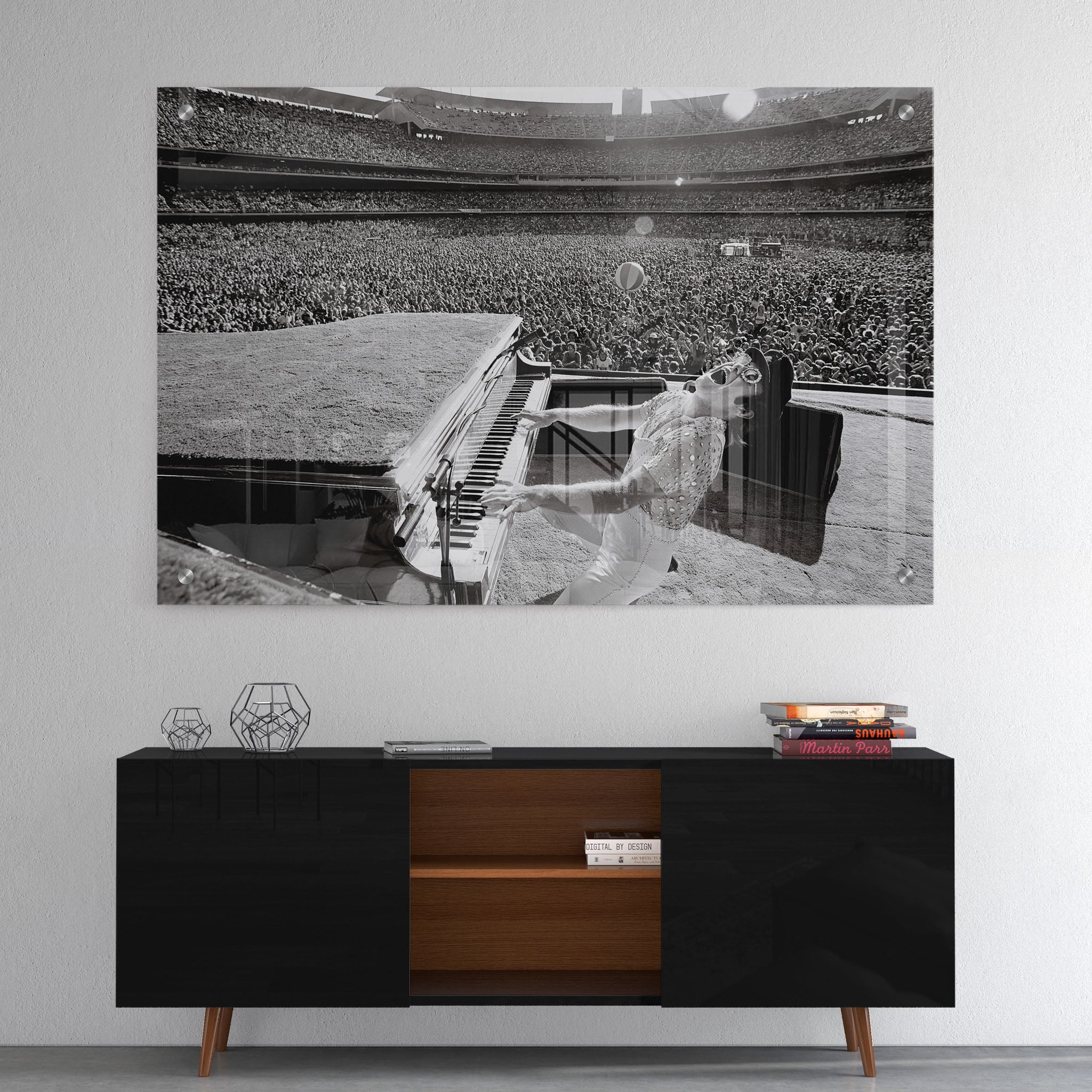 High-gloss acrylic glass black and white print of Elton John displayed above a contemporary console.