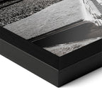 Detailed corner close-up of the premium black wooden frame holding the Elton John 1975 black and white concert poster.