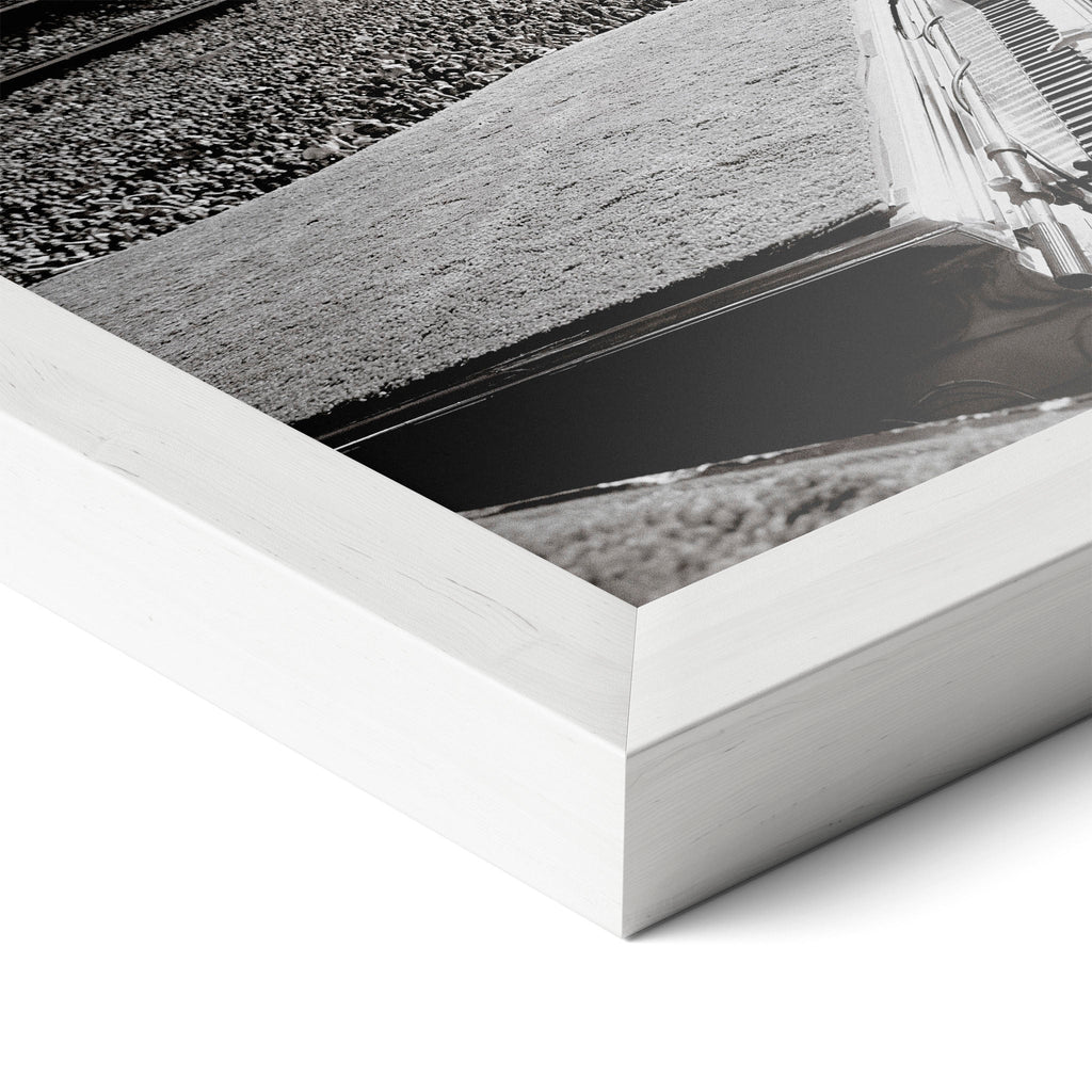 Corner close-up revealing the clean wood grain of the white framed Elton John 1975 black and white art print.