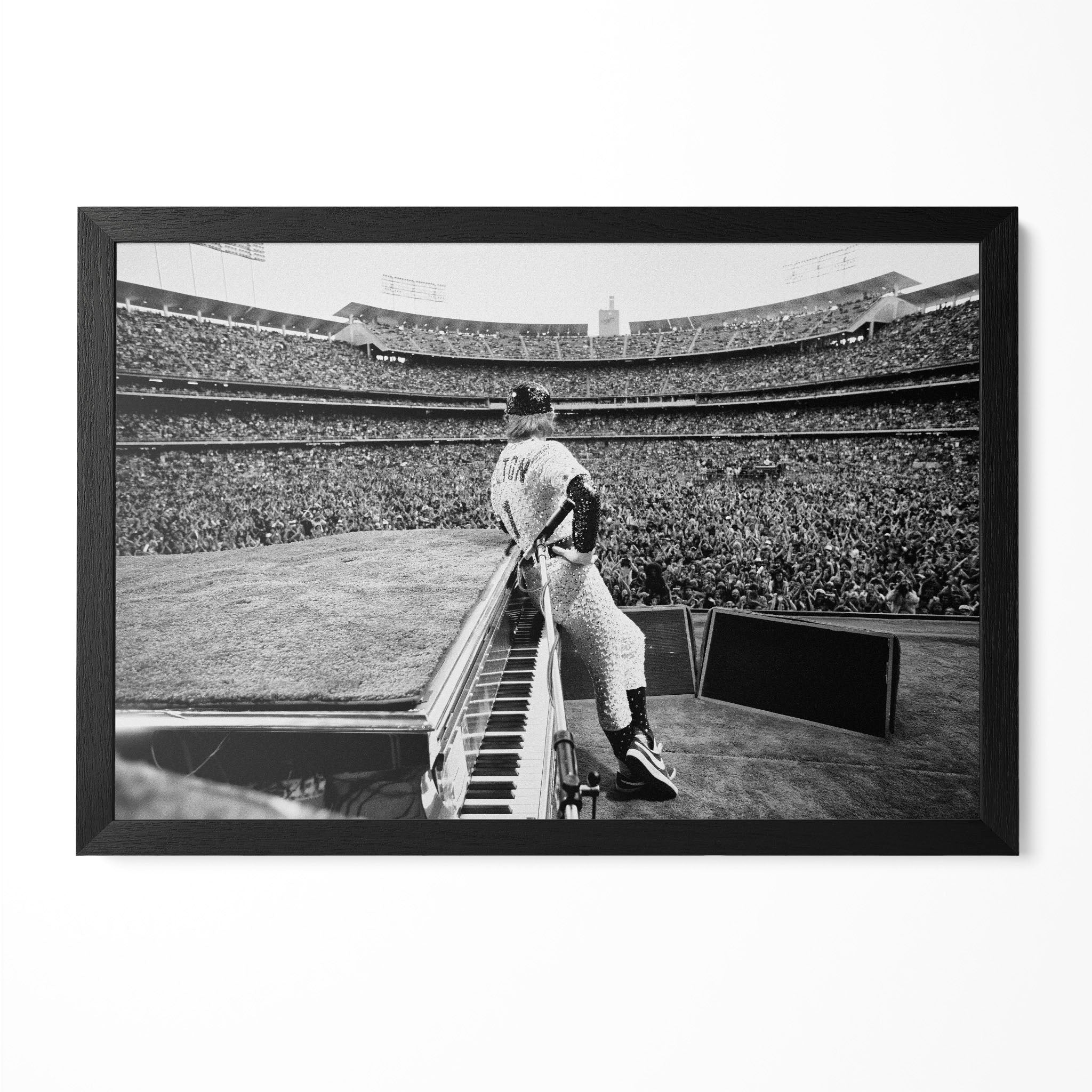 Elton John 1975 Dodger Stadium sequined baseball uniform black and white concert poster in a premium classic black wooden frame by POSTEREVER.