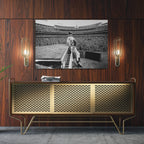 Sleek aluminum black and white metal print of Elton John displayed over a mid-century modern credenza.