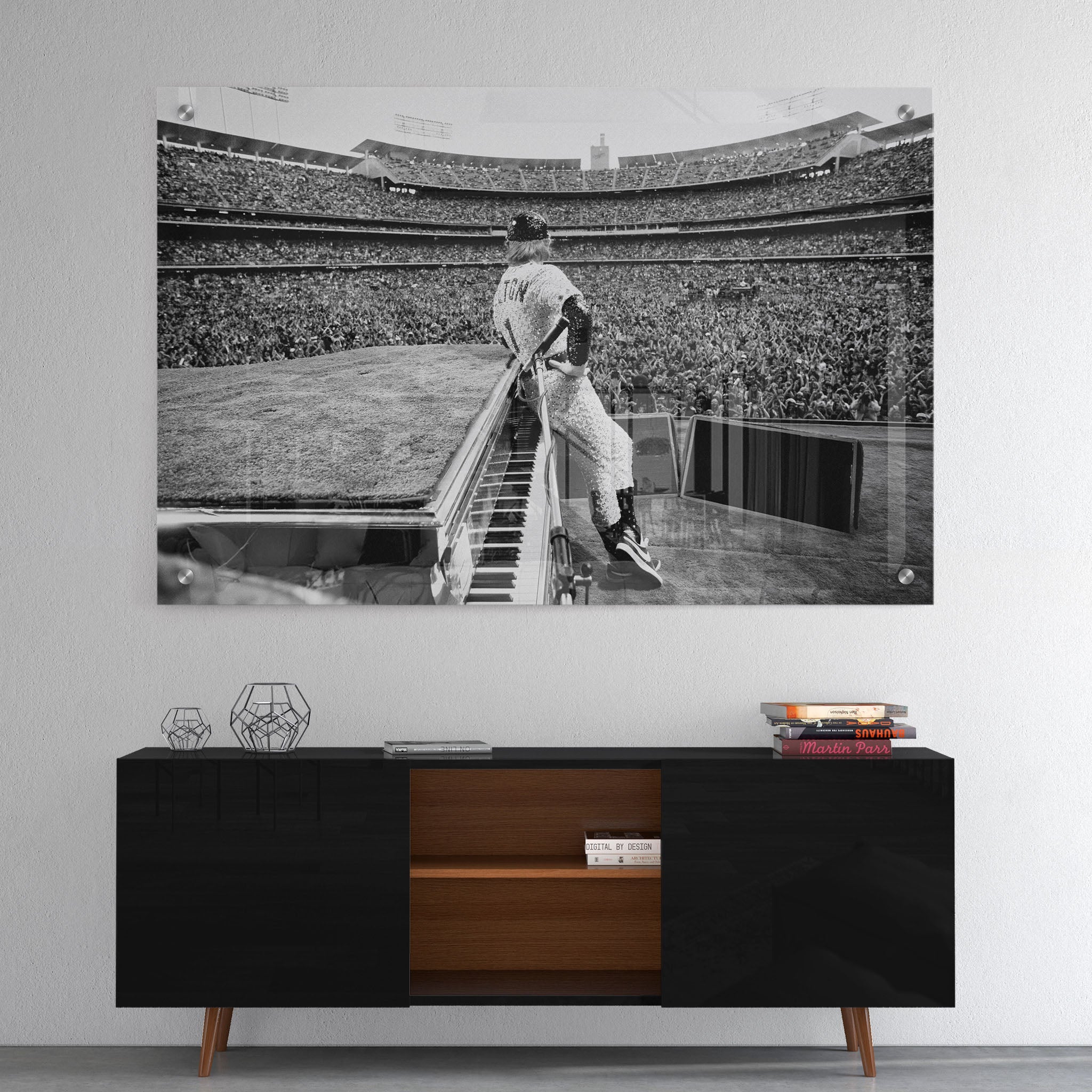 High-gloss acrylic glass black and white print of Elton John displayed above a contemporary console.
