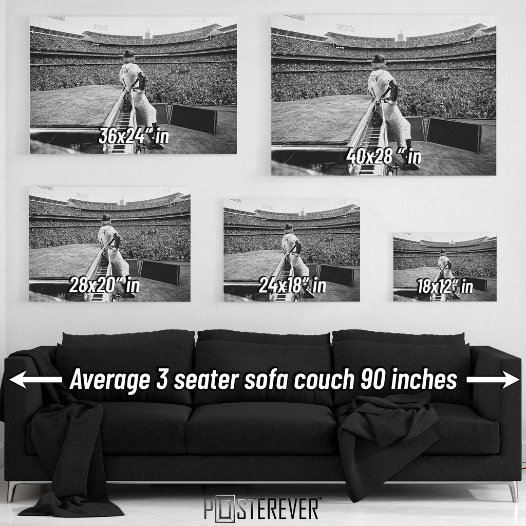 Elton John 1975 Dodger Stadium black and white wall art size comparison chart shown above an average 90-inch three-seater sofa.