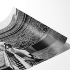 Angled close-up of the unframed premium matte black and white Elton John 1975 Dodger Stadium poster print.