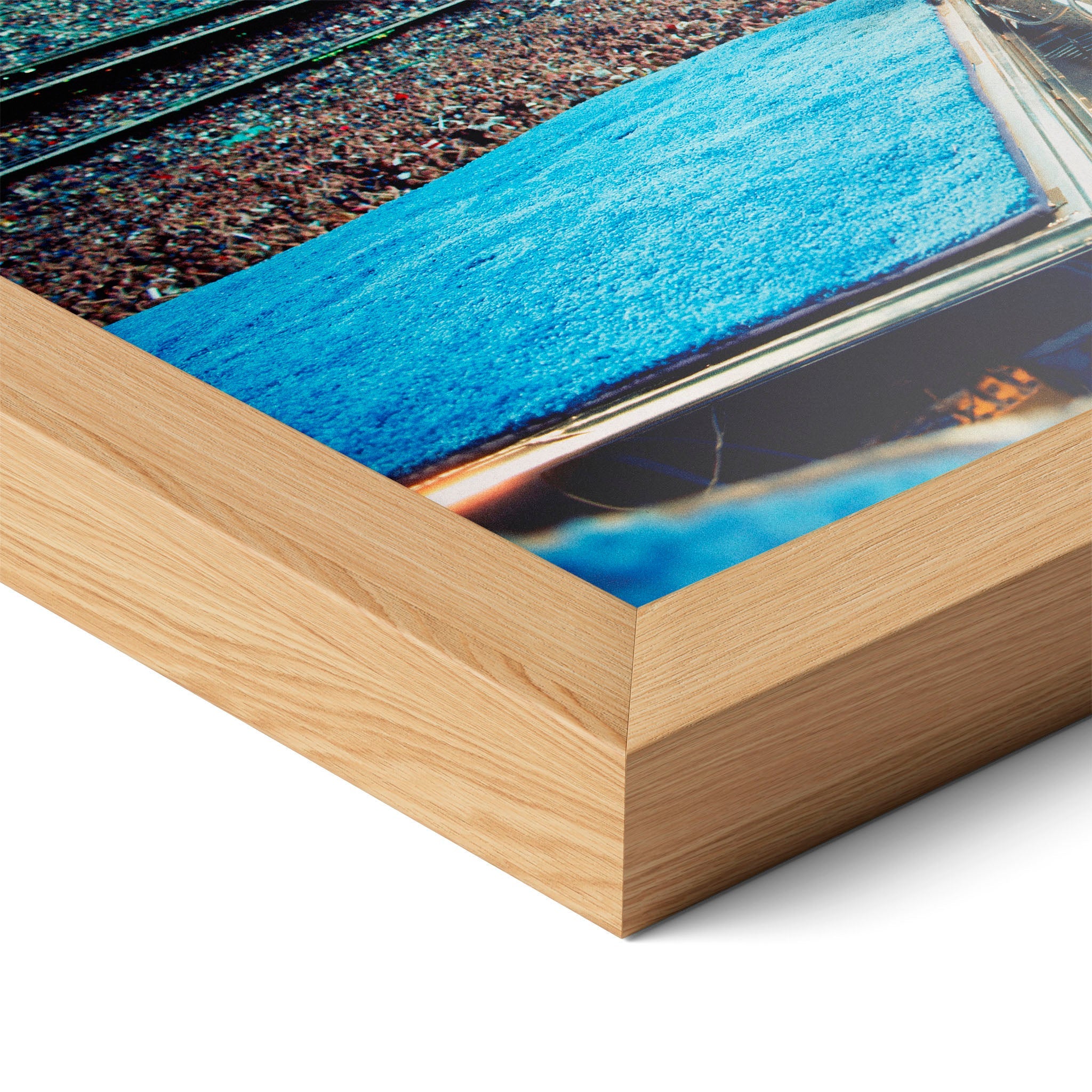 Corner close-up highlighting the natural oak finish of the framed Elton John 1975 colorized poster.