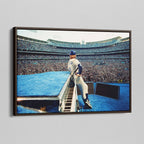Angled view of the Elton John 1975 colorized canvas in a sophisticated dark walnut floating frame.