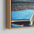 Corner close-up of the floating gap and grain texture of the natural wood canvas frame.