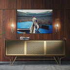 Sleek aluminum colorized metal print of Elton John displayed over a mid-century modern credenza.