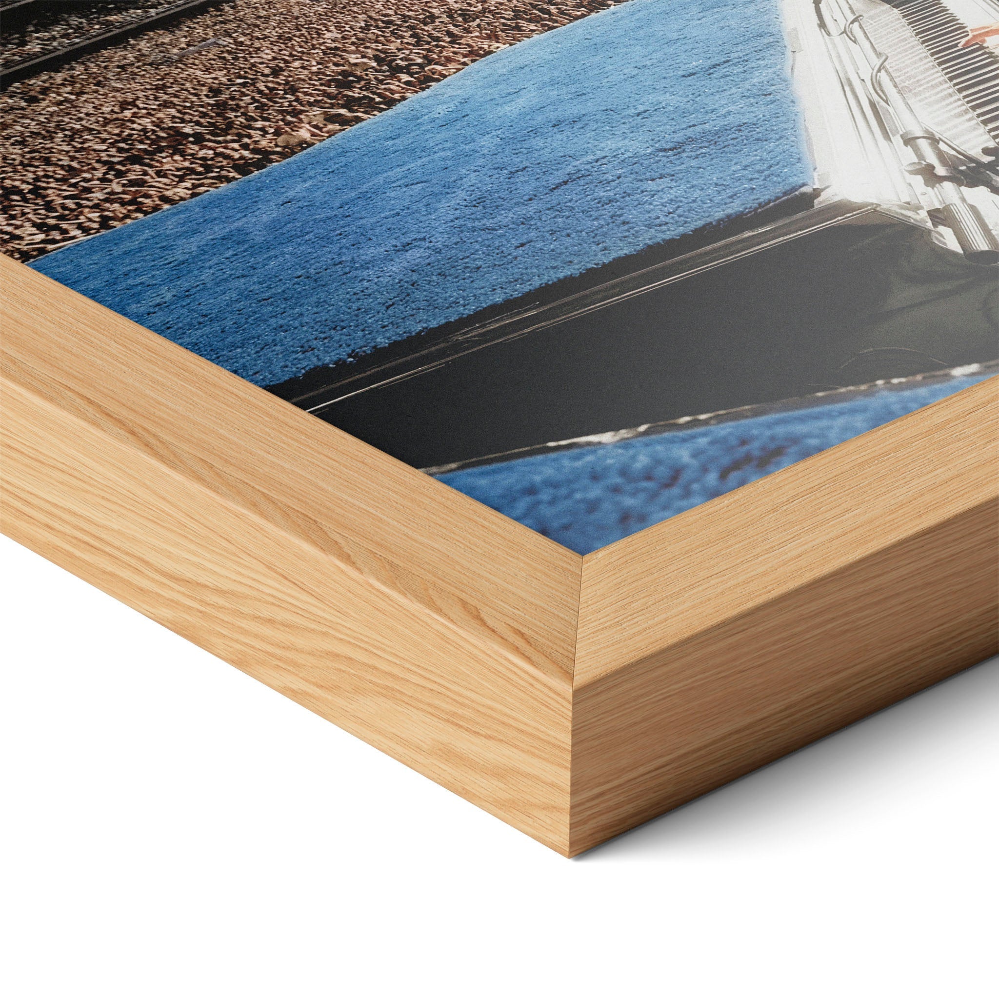 Corner close-up highlighting the natural oak finish of the framed Elton John 1975 colorized poster.