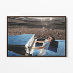 Front display of the Elton John 1975 colorized canvas in a premium dark walnut floating frame.