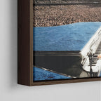 Corner close-up showing the rich grain and joinery of the dark walnut floating canvas frame.