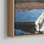 Corner close-up of the floating gap and grain texture of the natural wood canvas frame.