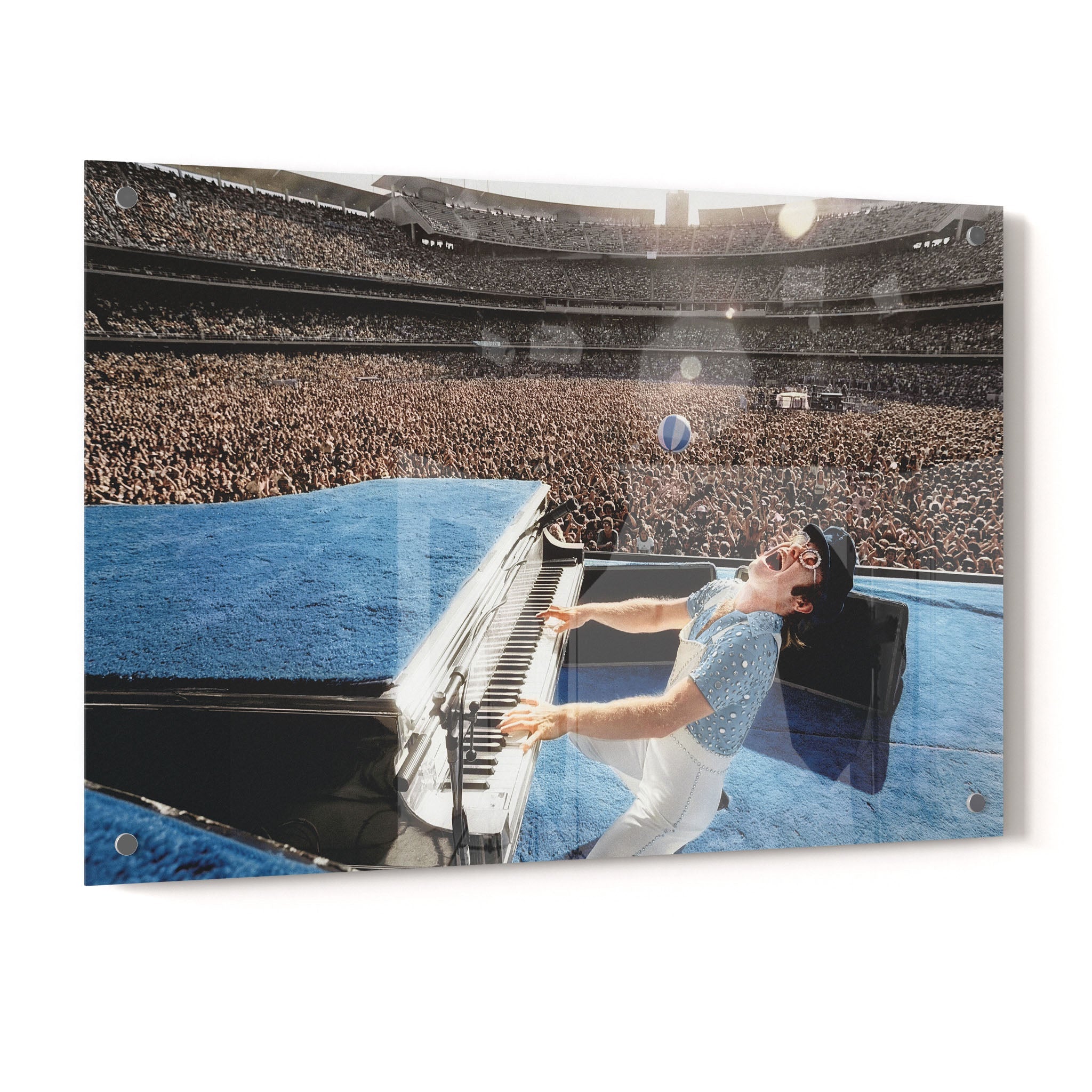 Crystal-clear acrylic glass colorized art print of Elton John 1975 with polished edges.