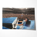 Unframed colour-enhanced Elton John 1975 Dodger Stadium poster print in his blue studded jumpsuit at the blue piano before 50,000 fans.