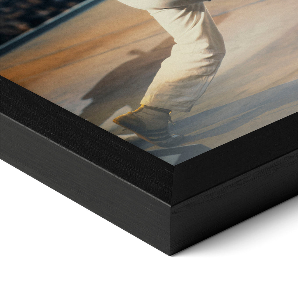 Close-up of the Freddie Mercury colour poster in a classic black wood frame
