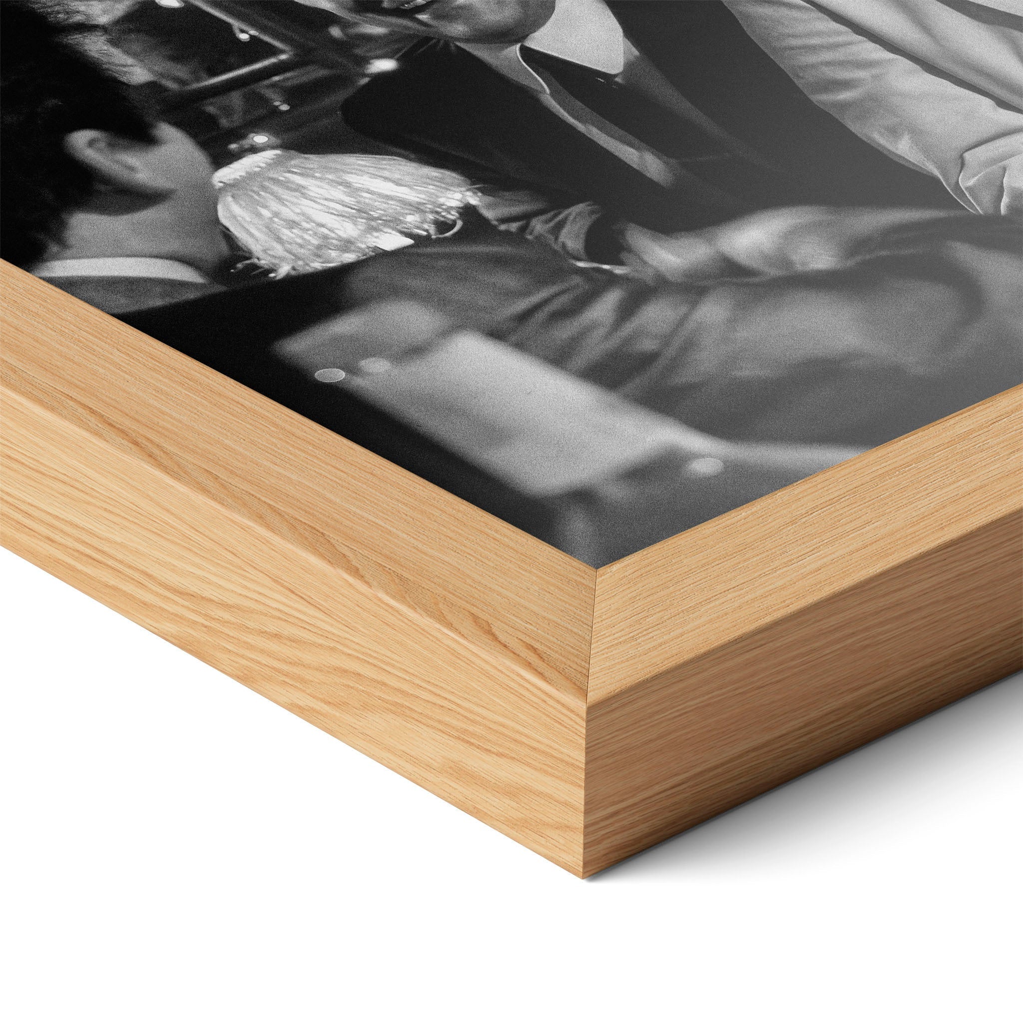 Corner close-up highlighting the natural oak finish of the framed Goodfellas Funny How black and white poster.