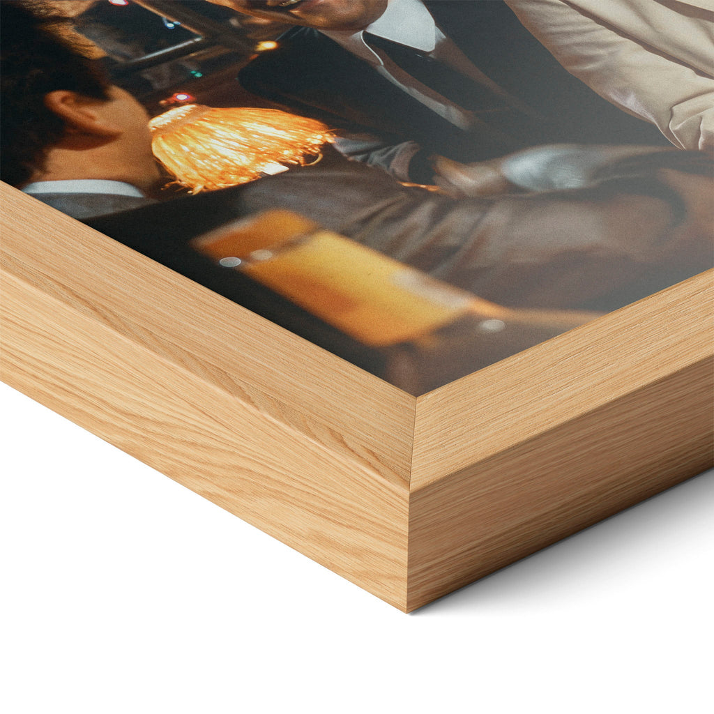 Corner close-up highlighting the natural oak finish of the framed Goodfellas Funny How movie poster.