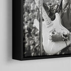 Corner close-up of the black floating frame on the Jimi Hendrix black and white canvas