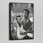 Angled view of the Jimi Hendrix black and white canvas in a dark walnut floating frame