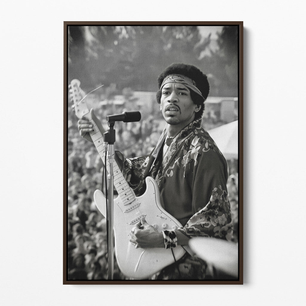 Front display of the Jimi Hendrix black and white canvas in a dark walnut floating frame