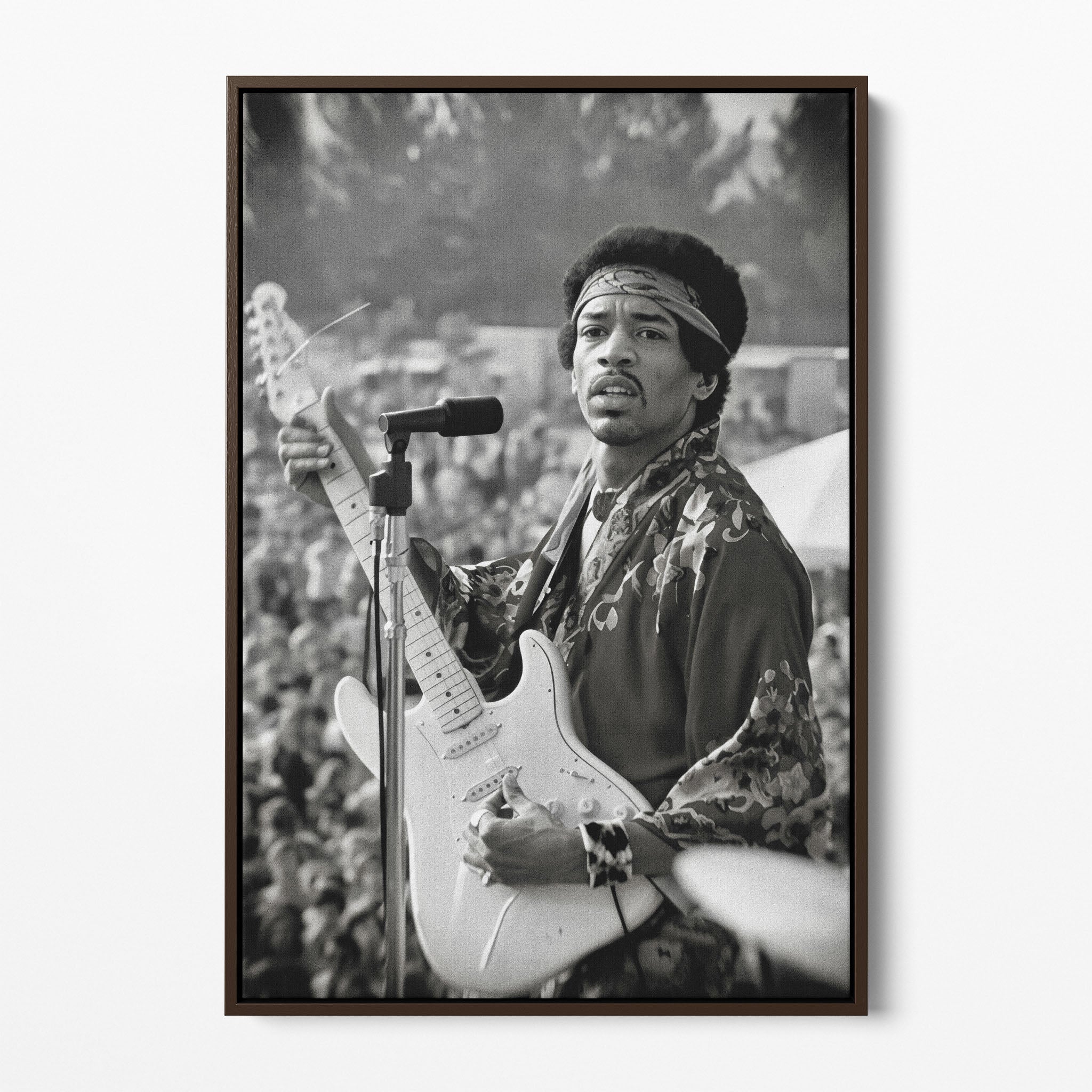 Front display of the Jimi Hendrix black and white canvas in a dark walnut floating frame