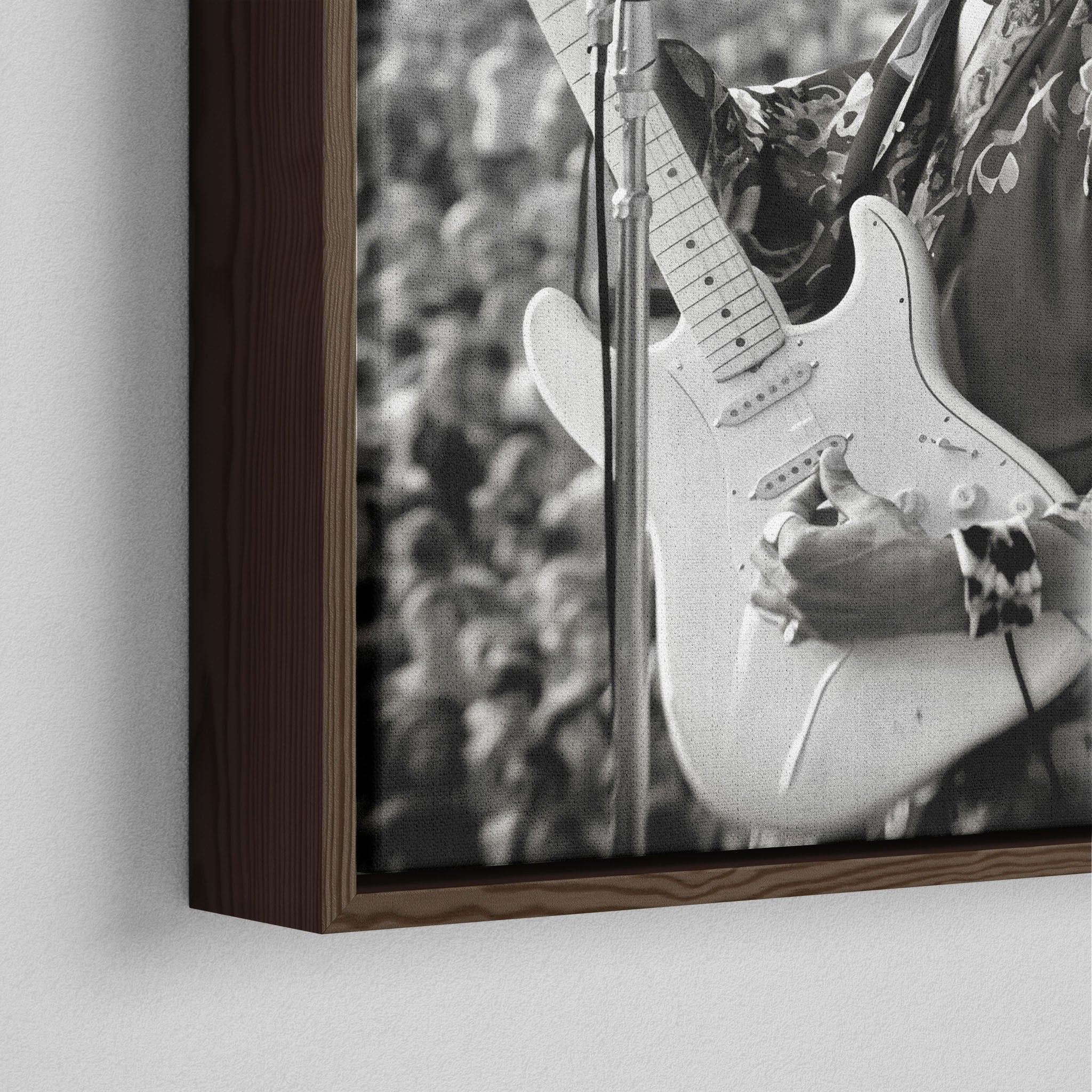Close-up of the dark walnut floating frame on the Jimi Hendrix black and white canvas