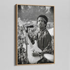 Angled view of the Jimi Hendrix black and white canvas in a natural oak floating frame