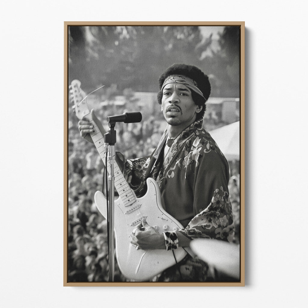 Front display of the Jimi Hendrix black and white canvas in a natural oak floating frame
