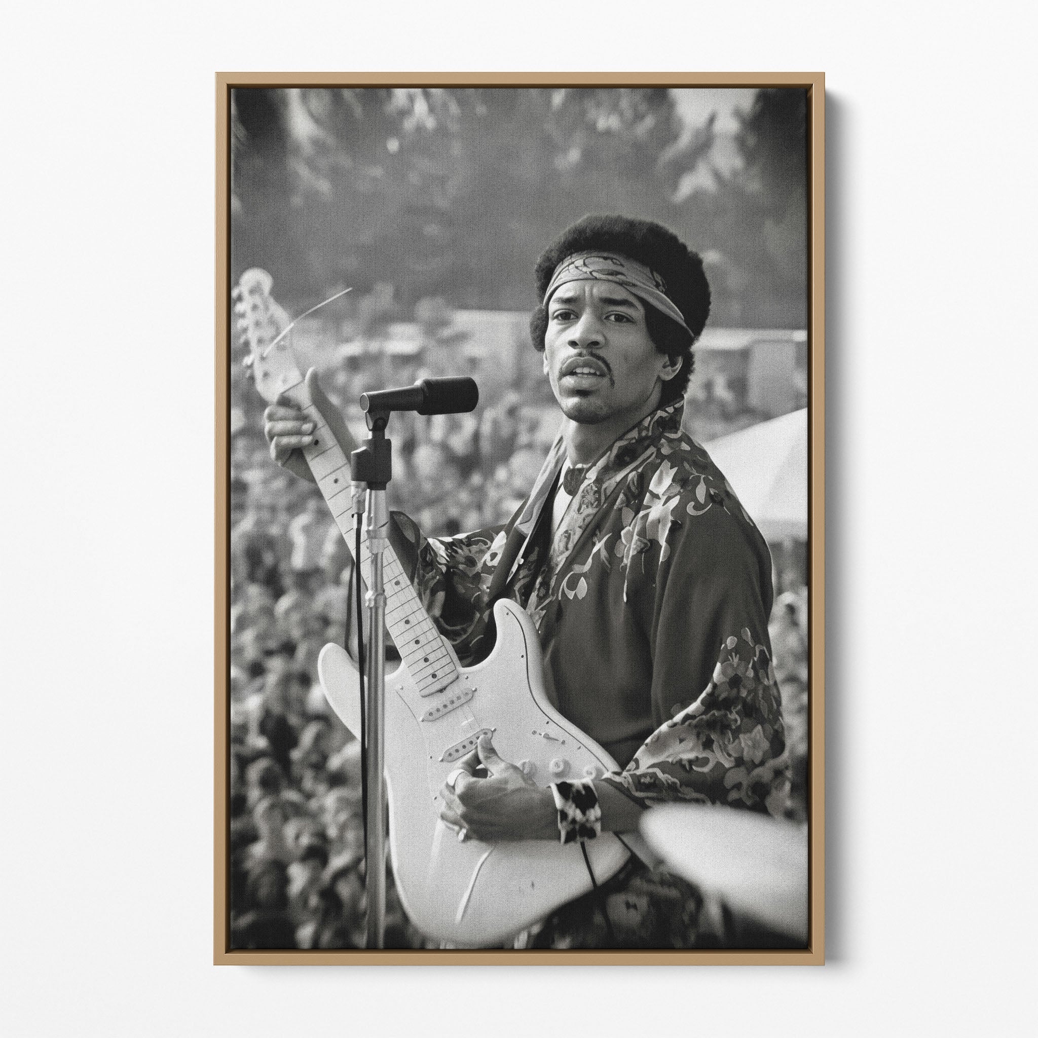 Front display of the Jimi Hendrix black and white canvas in a natural oak floating frame