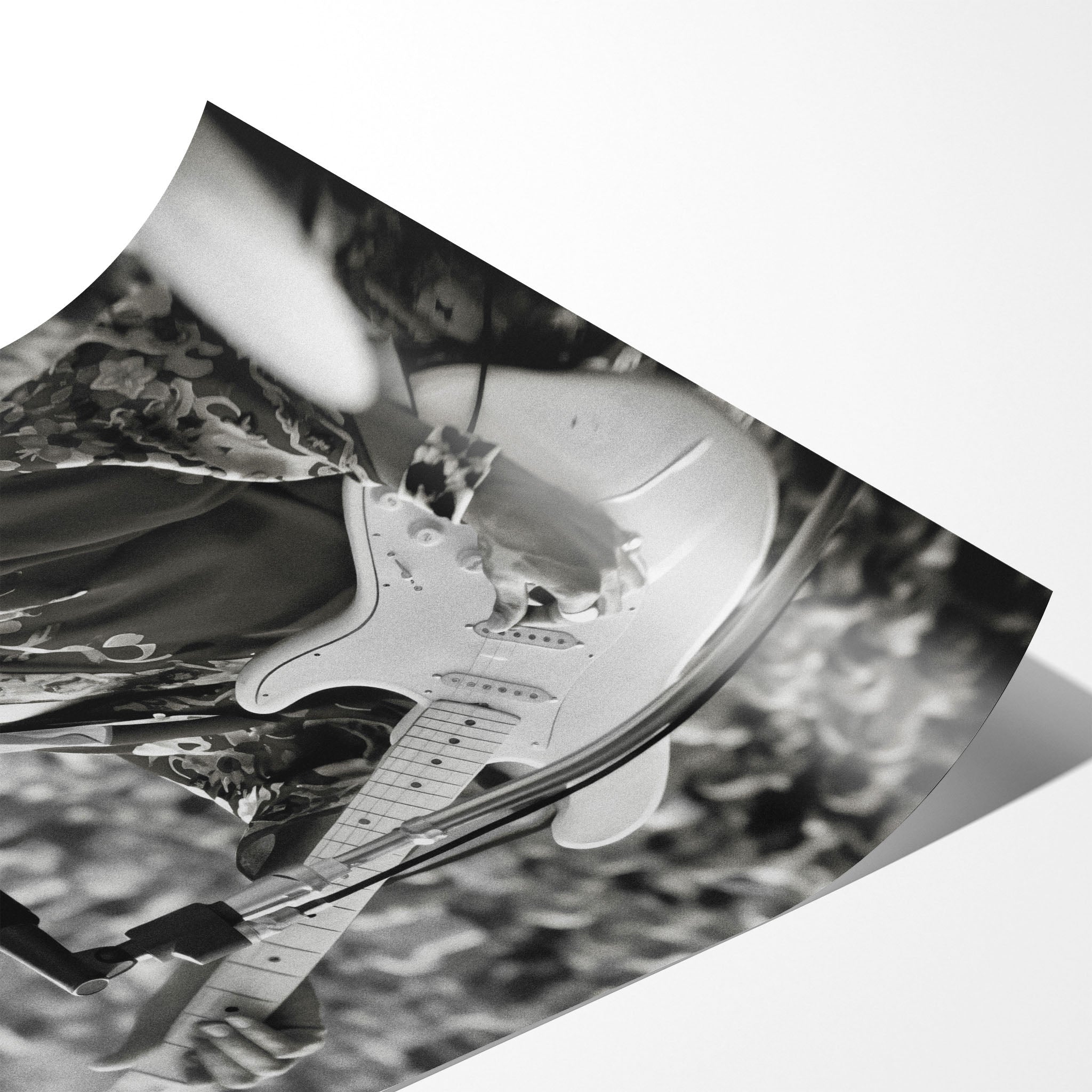 Angled close-up of the unframed Jimi Hendrix black and white poster showing fine paper detail