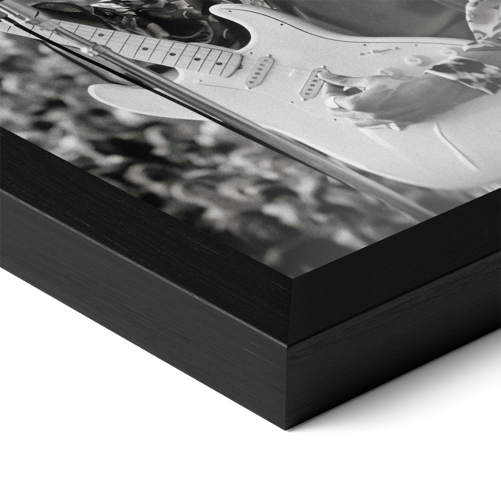 Close-up of the Jimi Hendrix black and white poster in a classic black wood frame