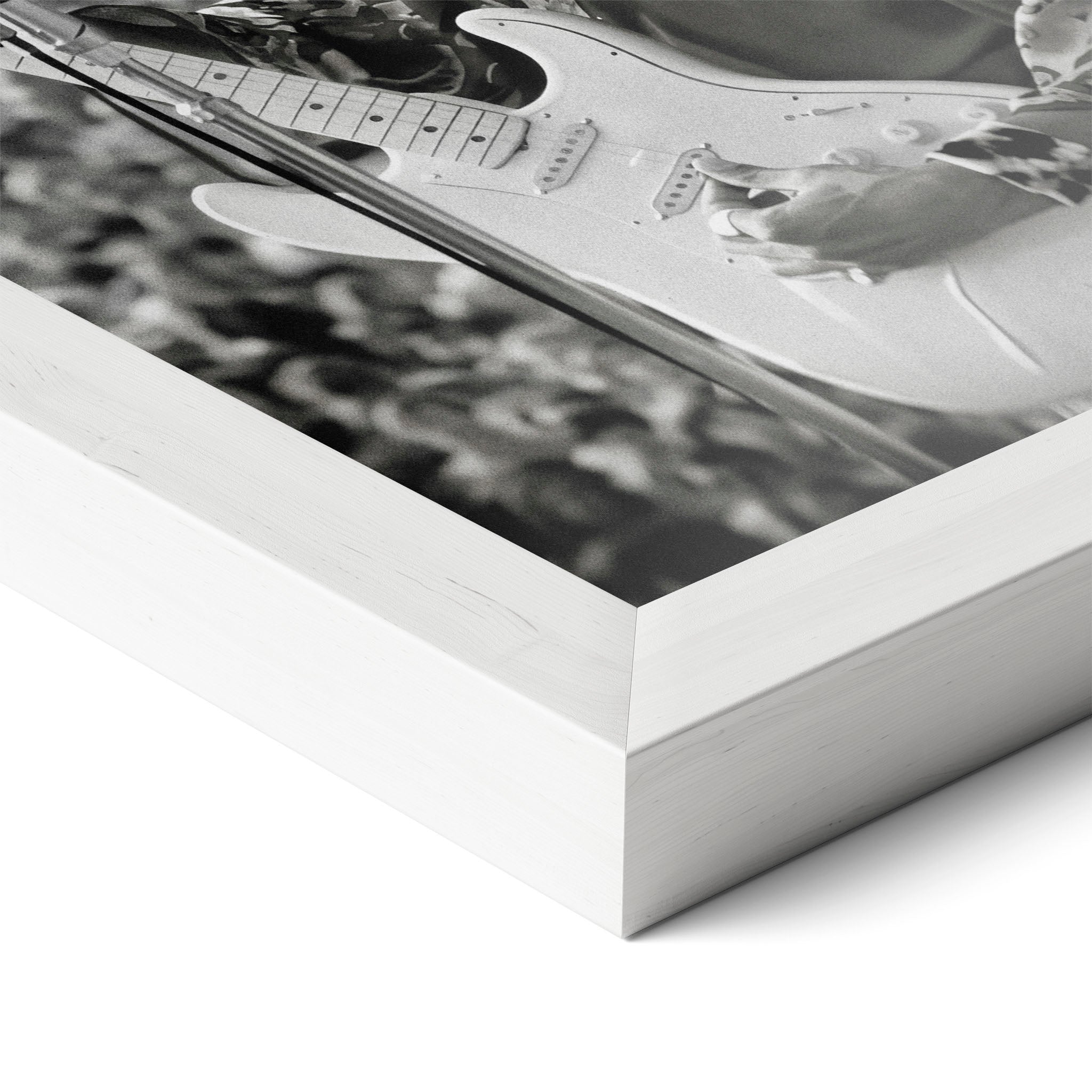 Corner close-up of the Jimi Hendrix black and white poster in a white frame