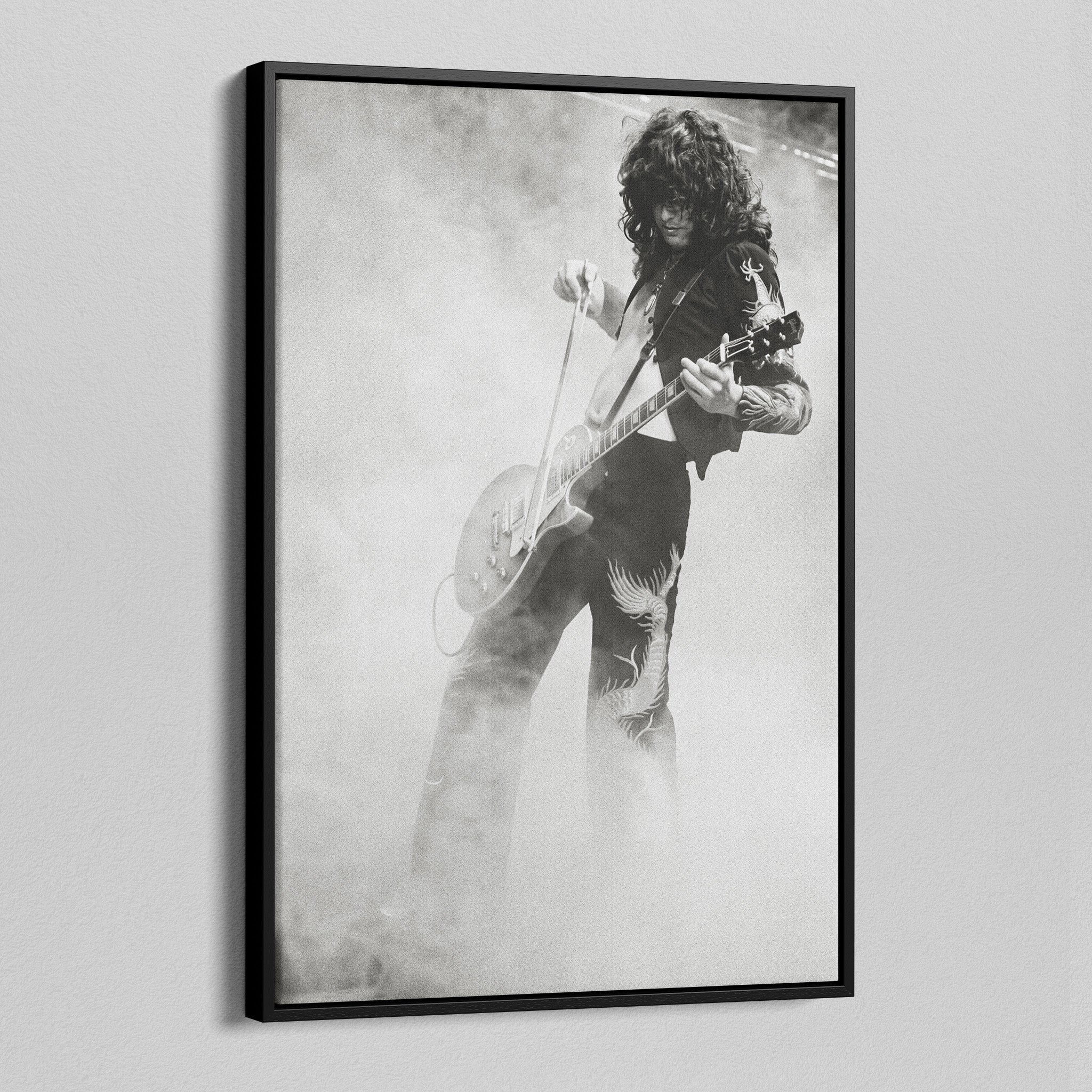 Angled view of the Jimmy Page black and white canvas in a black floating frame