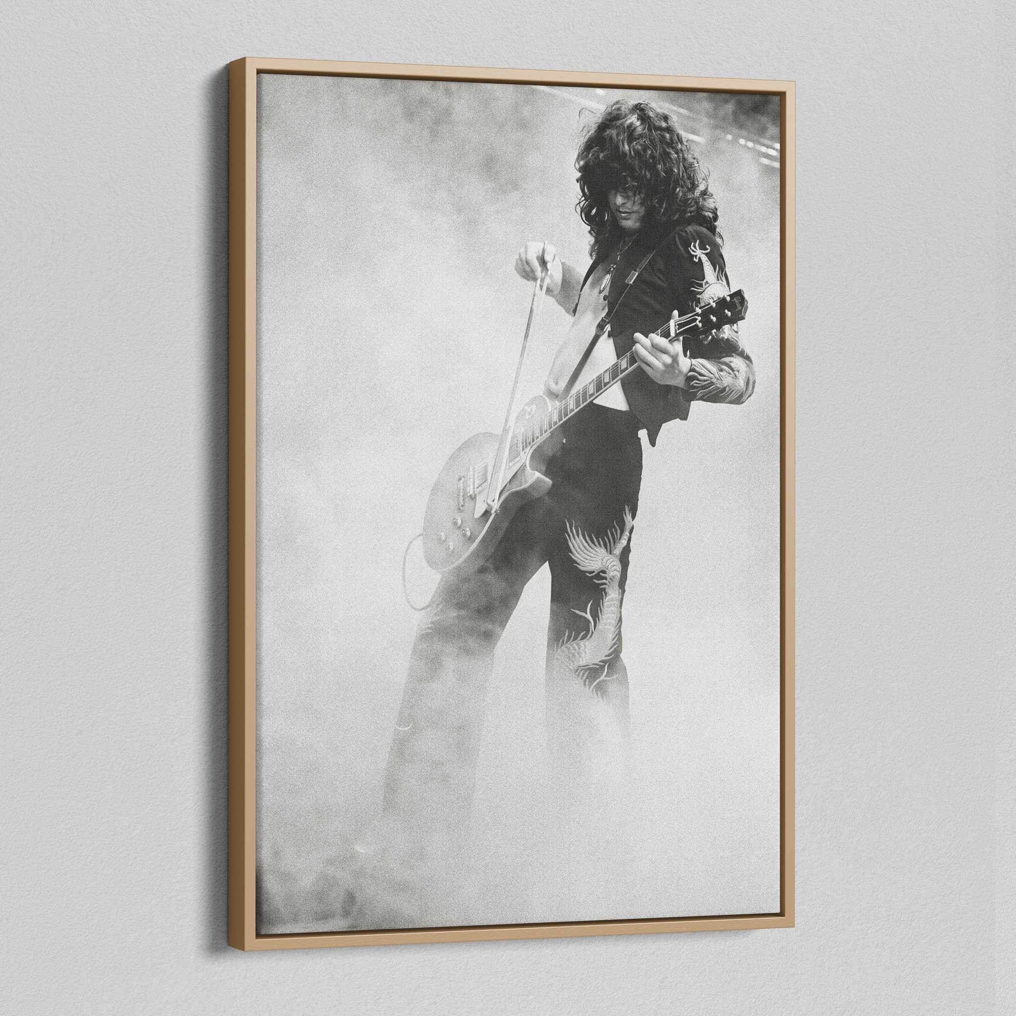 Angled view of the Jimmy Page black and white canvas in a natural oak floating frame
