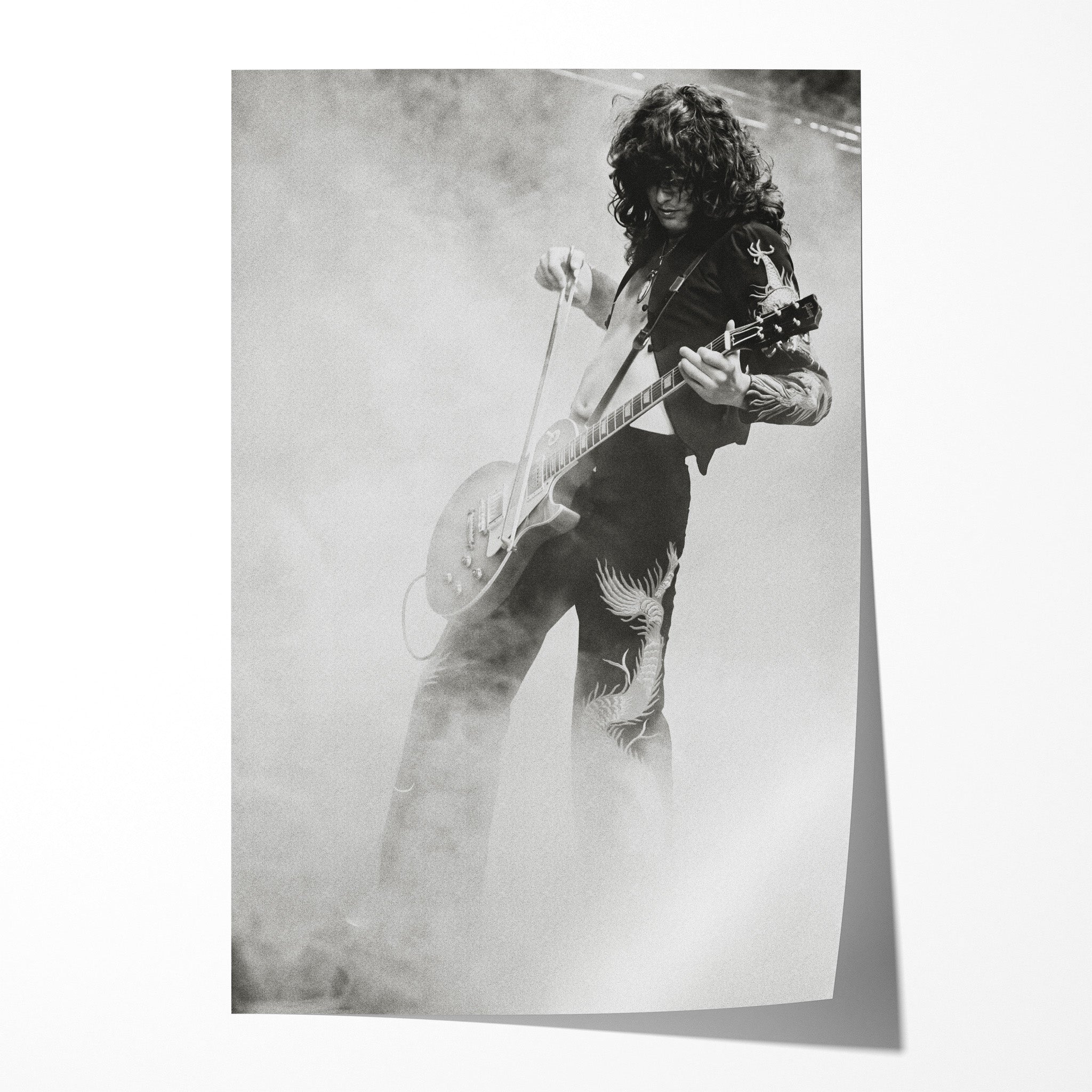 Unframed black and white print of Jimmy Page performing the violin bow solo at Tampa 1973