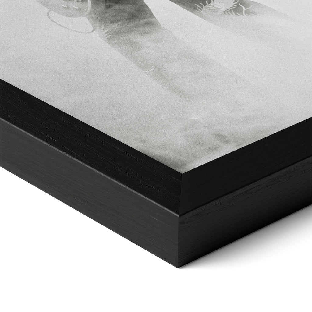 Close-up of the Jimmy Page black and white poster in a classic black wood frame