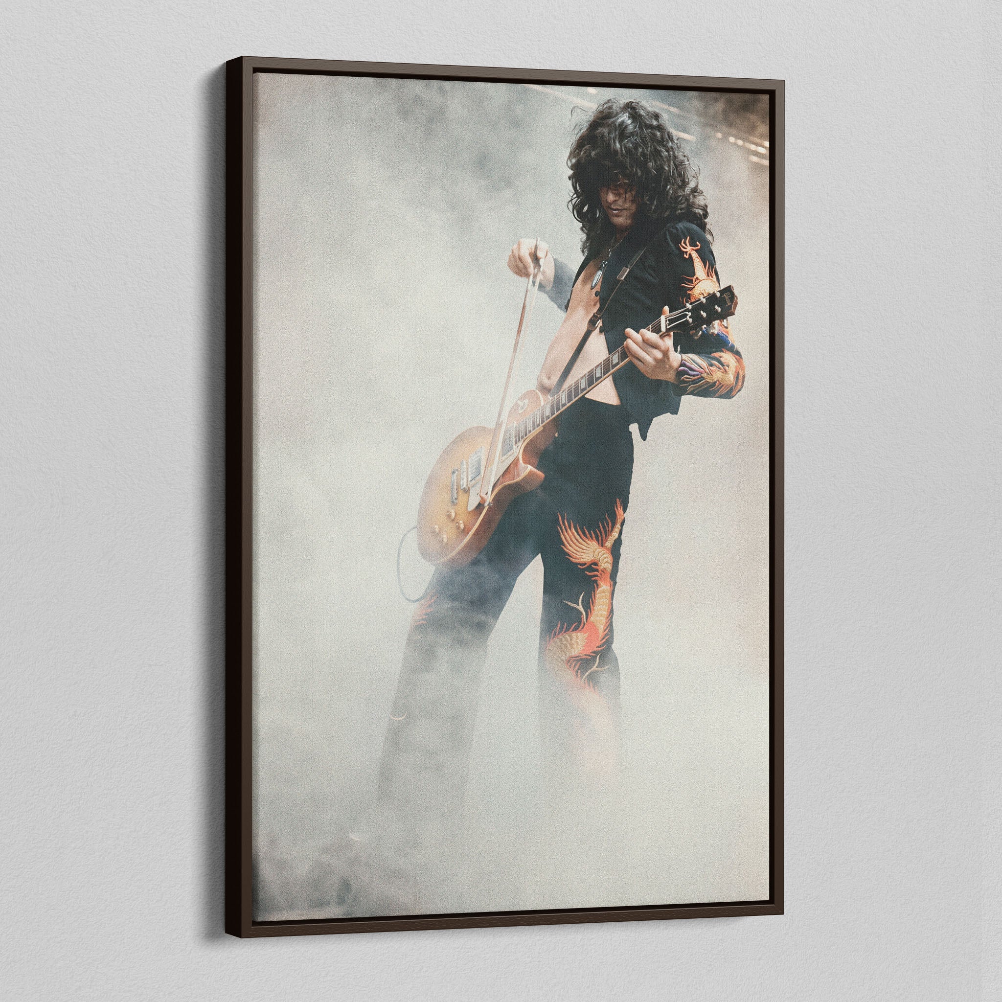 Angled view of the Jimmy Page colorized canvas in a dark walnut floating frame