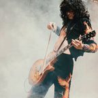 Zoomed detail of Jimmy Page's dragon suit and sunburst Les Paul in colour